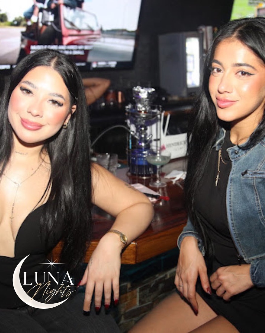 Friends at the bar with hookah behind